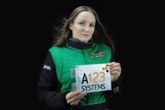 Eva Hakansson with one of the insanely powerful A123 Systems battery cells that power the KillaJoule and Green Envy.